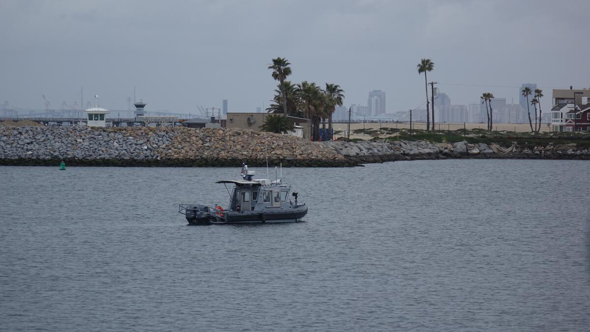 A U.S. Navy security boat crew stands watch for intruders in Anaheim Bay on April 12.