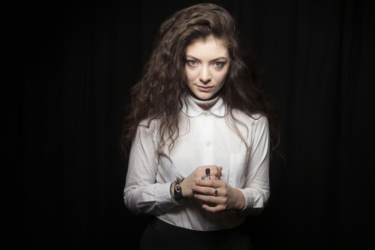 Australian singer Lorde poses for a portrait in New York. Lorde's "Royals" could be crowned with Grammy gold. The breakthrough singer will perform at the Grammy Awards nominations special on Friday in Los Angeles.