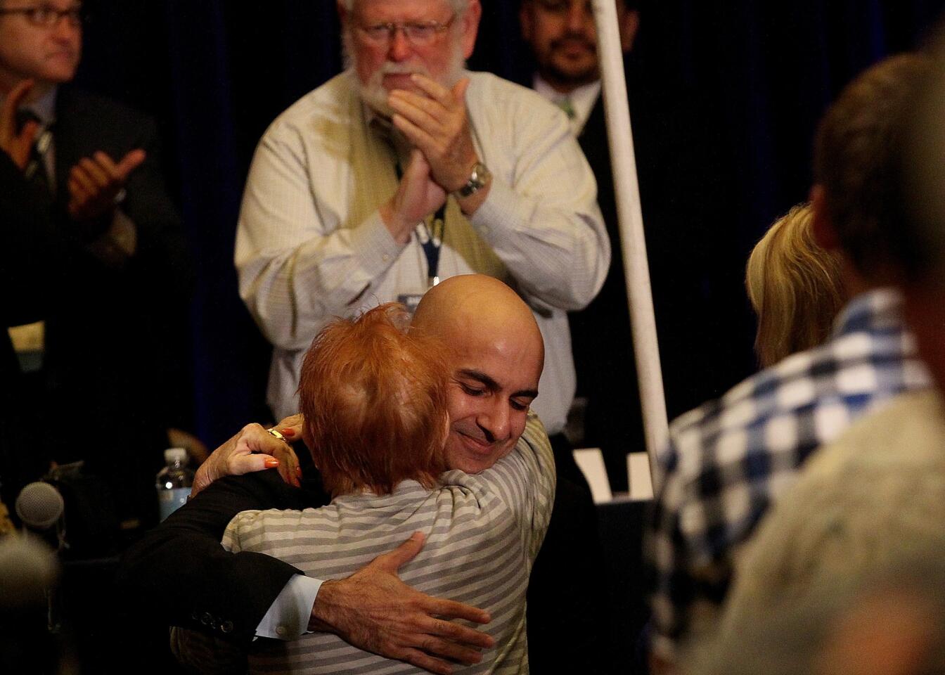 Republican gubernatorial candidate Neel Kashkari is greeted by a supporter after delivering a speech to delegates at the California Republican Convention at the LAX Marriott on Sept. 21.