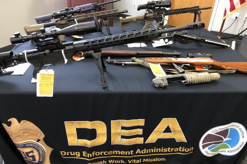 Some of the guns seized from a methamphetamine distribution network.