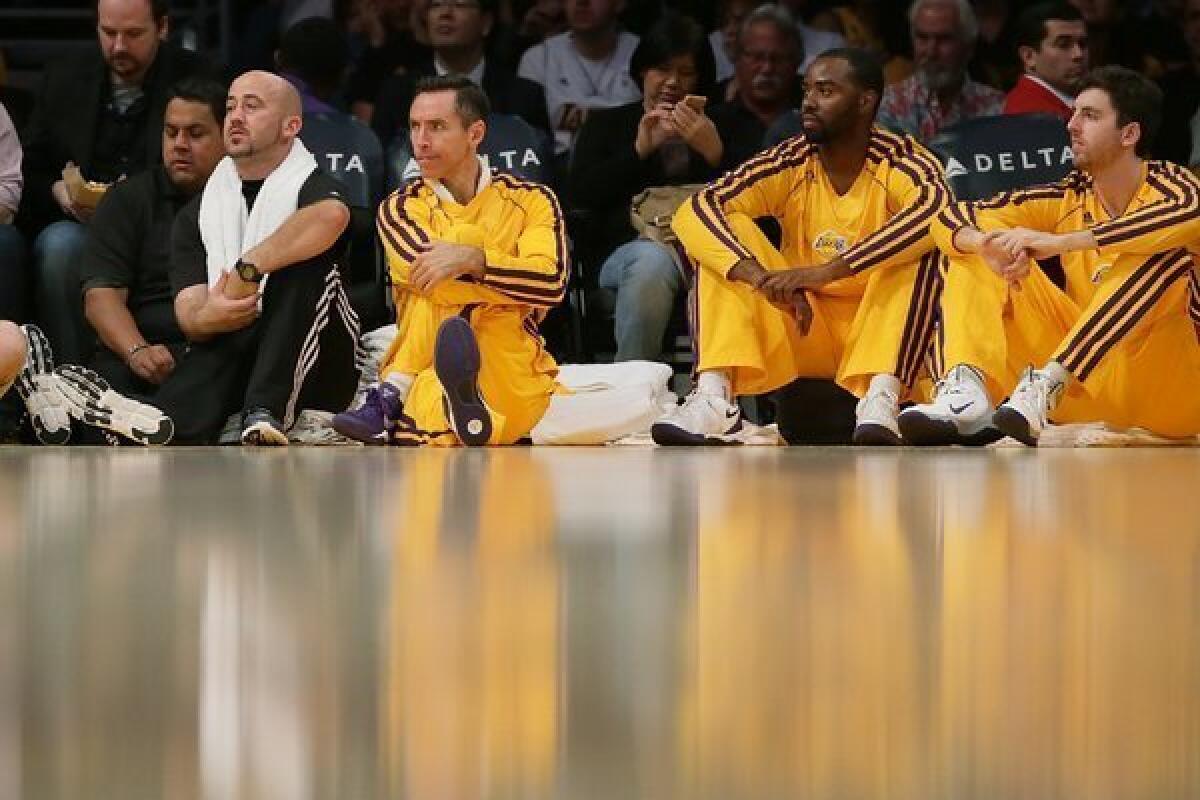 Lakers guard Steve Nash watches his team play on Oct. 22.