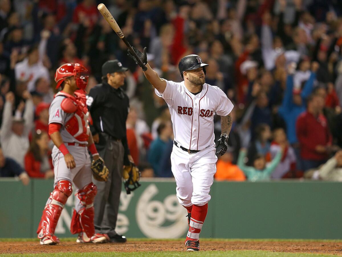 Boston's Mike Napoli hits his second home run of the game Saturday in the sixth inning against the Angels at Fenway Park.