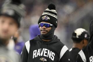 Baltimore Ravens quarterback Lamar Jackson (8) looks on during the second half of an NFL football game 