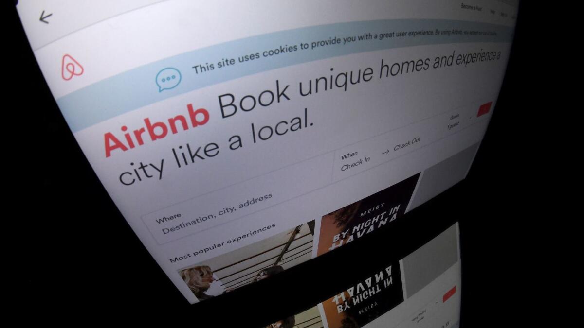 This 2017 photo shows the Airbnb logo displayed on a computer screen. Short-term rentals have been the source of fierce debate in Laguna Beach, given the surging popularity of rental sites like Airbnb.
