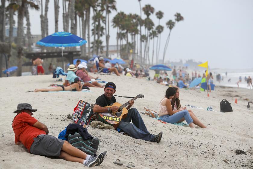 San Clemente, CA, Thursday, August 5, 2022 - A busy summer day at the beach south of the San Clemente pier. San Clemente City Council is proposing an abortion ban. (Robert Gauthier/Los Angeles Times)