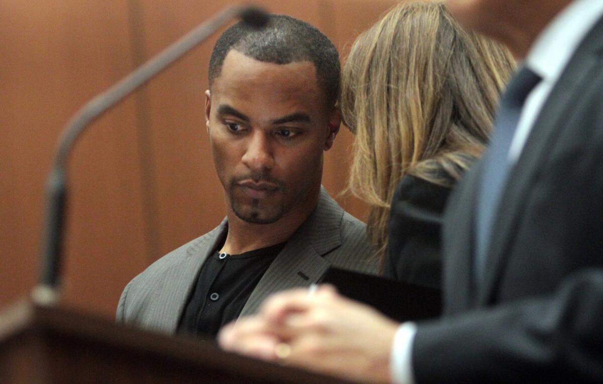 Former NFL safety Darren Sharper, with his attorney Blair Berk, pleads not guilty to charges of drugging and raping a pair of women he met at a West Hollywood nightclub, in a Los Angeles Superior courtroom Thursday.