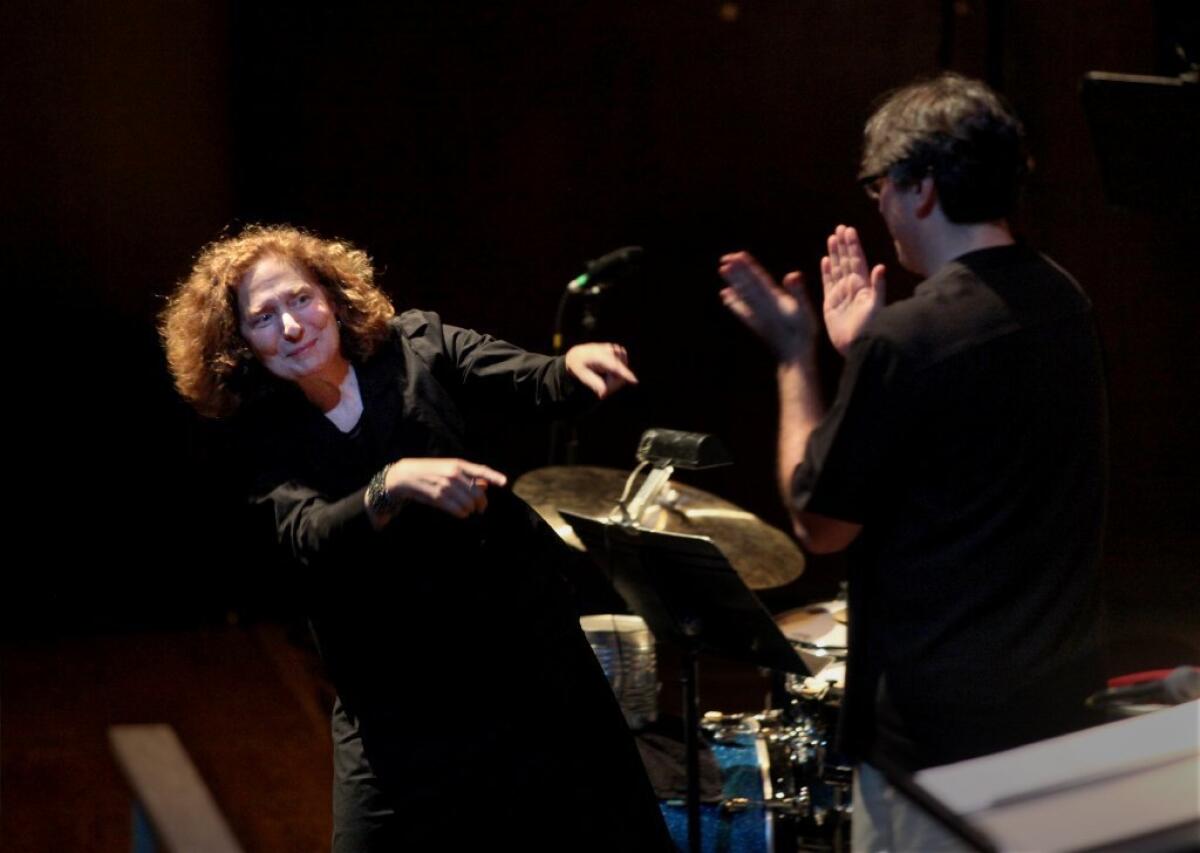Julia Wolfe, left, and conductor Julian Wachner after "Anthracite Fields" was performed by the Choir of Trinity Wall Street and Bang on a Can All-Stars at Lincoln Center in New York in May 2014.