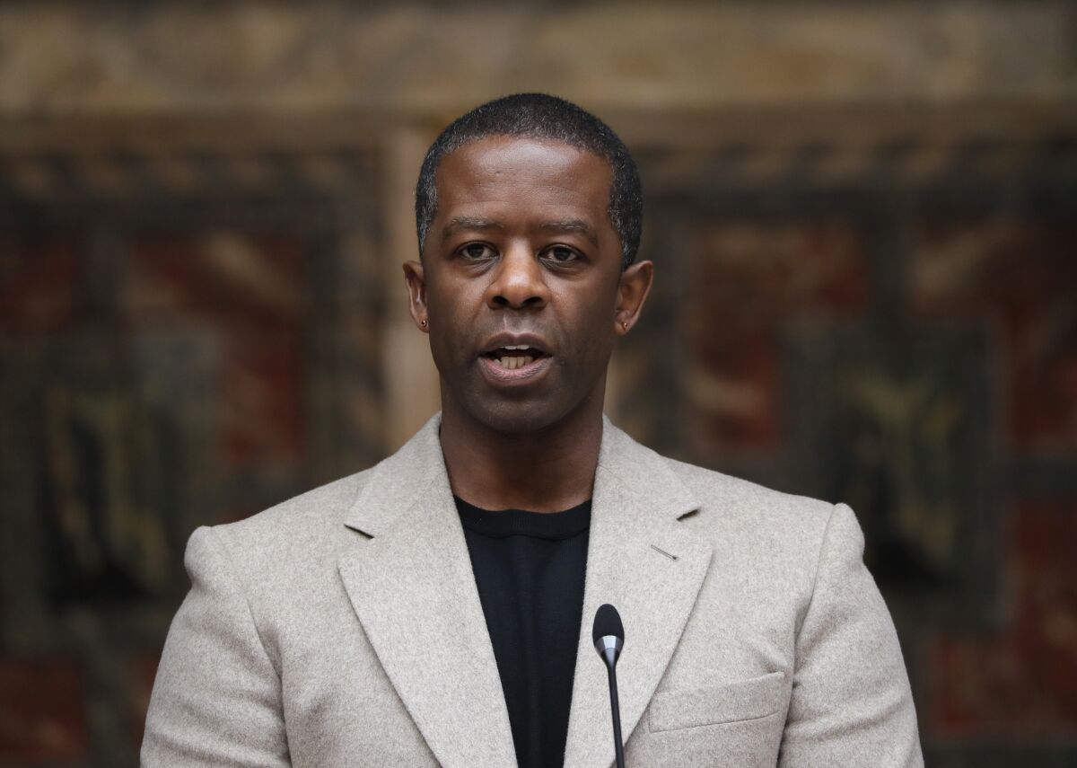 FILE - In this May 10, 2021 file photo, British actor Adrian Lester speaks on stage at the official signing in ceremony for Sadiq Khan as the Mayor of London at Shakespeare's Globe Theatre in London. “The Lehman Trilogy” was able to make only four preview performances on Broadway before the pandemic shut its doors. Now it plans to return to tell the story of an American financial giant’s downfall with a new cast member. Stefano Massini’s play about what led to the collapse of Lehman Brothers — adapted by Ben Power and directed by Sam Mendes — will add Adrian Lester, replacing Ben Miles, and joining Simon Russell Beale and Adam Godley. (AP Photo/Kirsty Wigglesworth, File)