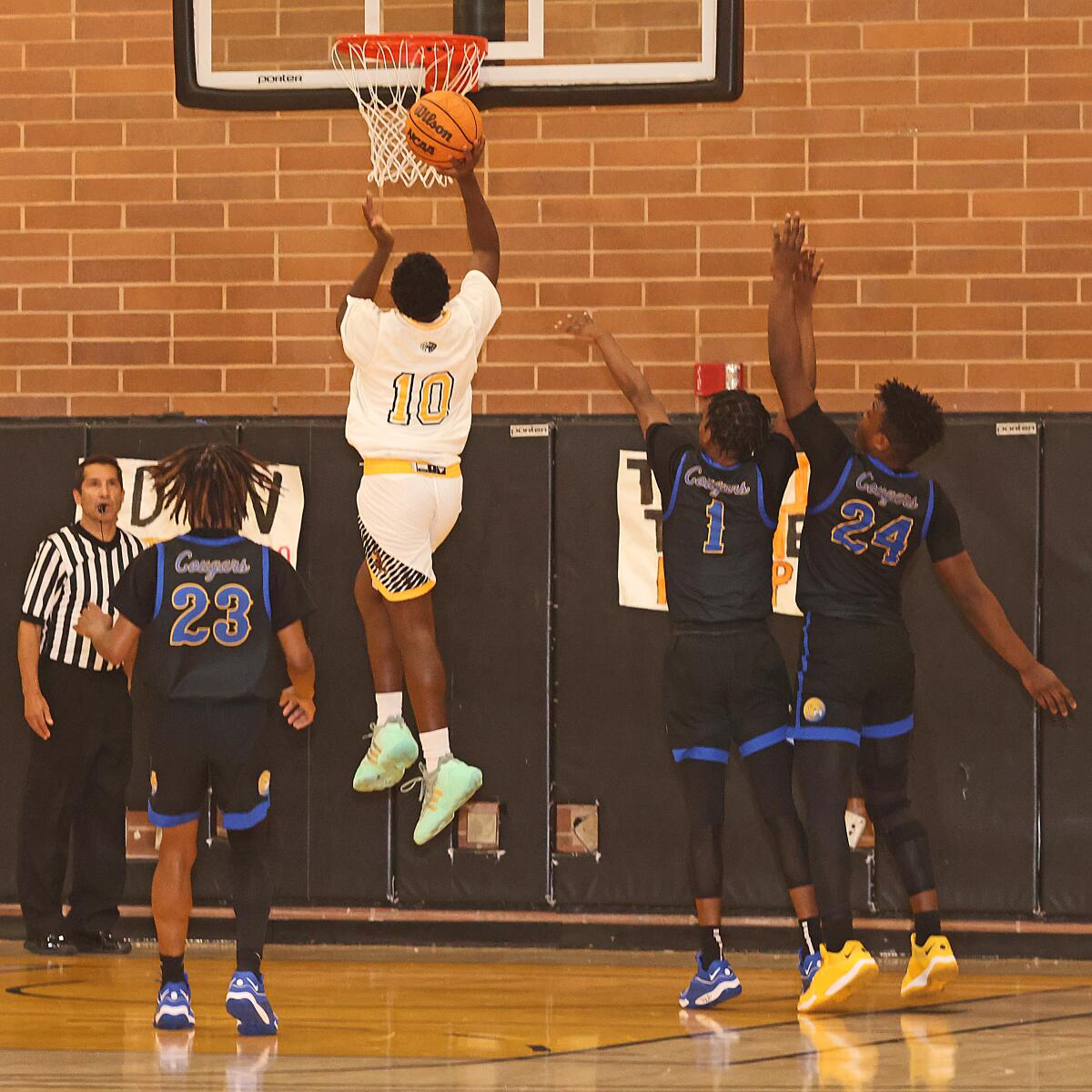 Freshman Semaj Howard of King/Drew goes up for shot against Crenshaw.