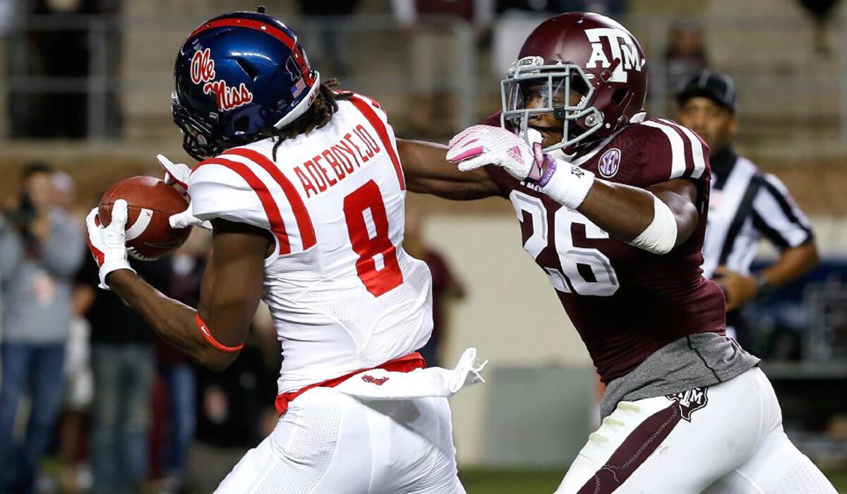 Mississippi Quincy Adeboyejo (8) hauls in a 33-yard touchdown past Texas A&M defensive back Devonta Burns (26) in the third quarter Saturday.