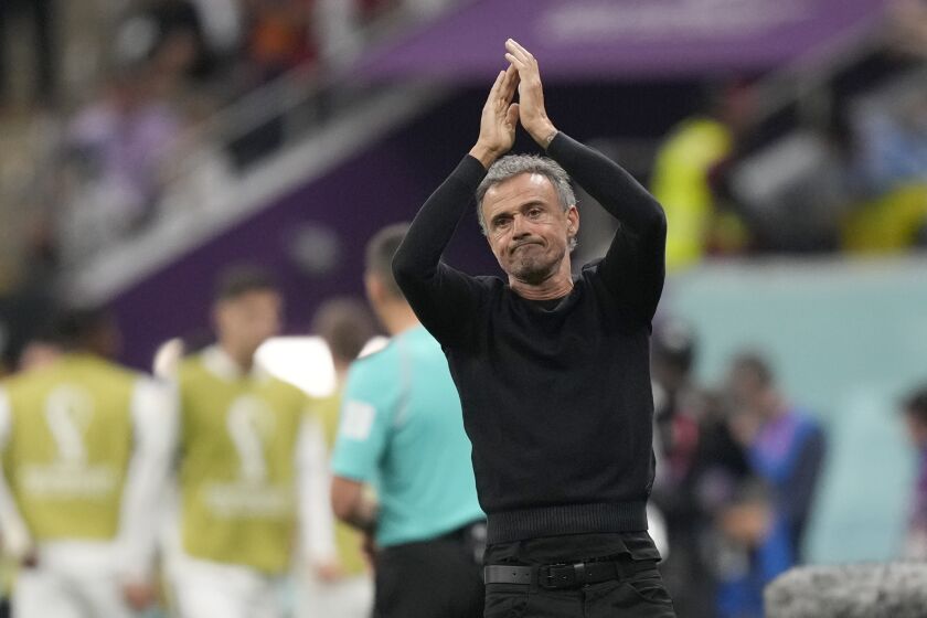 Spain's head coach Luis Enrique claps his hands during the World Cup group E soccer match between Spain and Germany, at the Al Bayt Stadium in Al Khor , Qatar, Sunday, Nov. 27, 2022. (AP Photo/Matthias Schrader)
