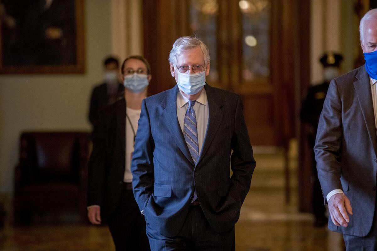 Senate Majority Leader Mitch McConnell walks to his office after leaving the Senate floor on Capitol Hill on June 17.