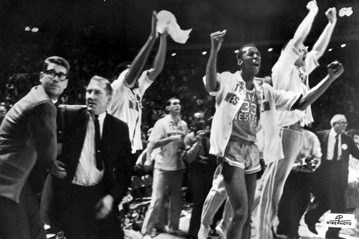 Texas Western basketball coach Don Haskins and players celebrate after winning the 1966 national championship 
