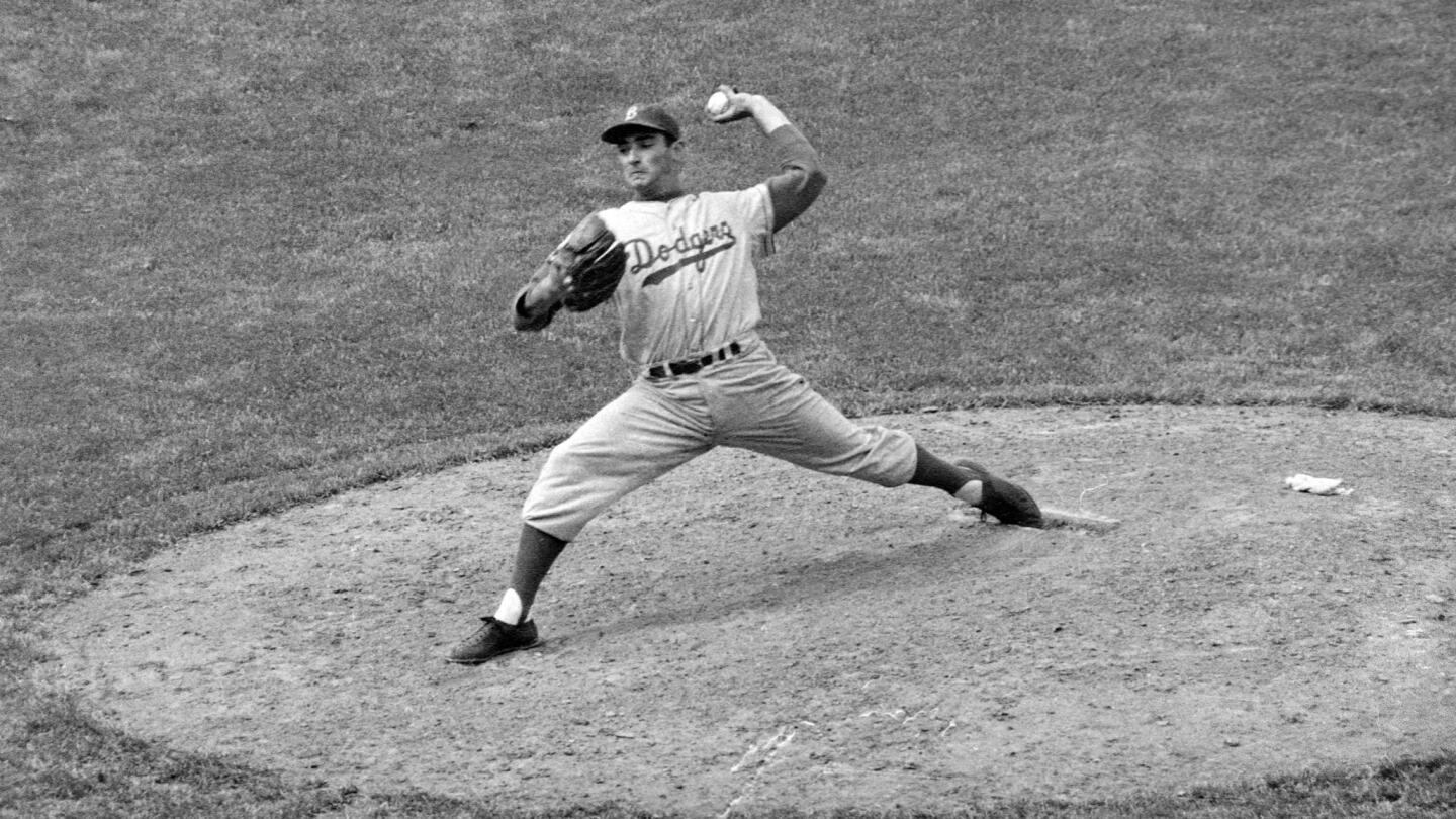 Sandy Koufax delivers a pitch during a May 1957 game against the Chicago Cubs. The Brooklyn Dodgers starter struck out 13 batters and allowed four hits in the 3-2 win.