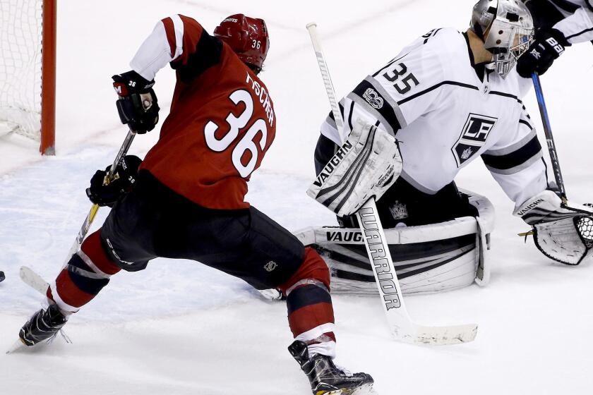 Arizona Coyotes right wing Christian Fischer (36) scores the winning goal as he gets the puck past Los Angeles Kings goalie Darcy Kuemper (35) during overtime of an NHL hockey game Friday, Nov. 24, 2017, in Glendale, Ariz. The Coyotes defeated the Kings 3-2. (AP Photo/Ross D. Franklin)