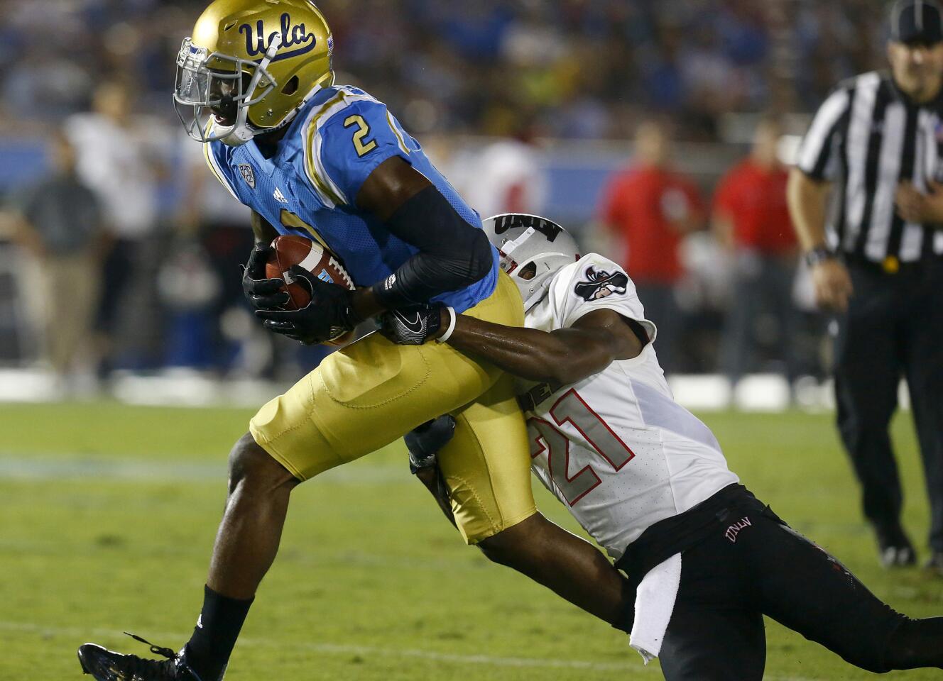 UCLA wide receiver Jordan Lasley makes a catch against UNLV defensive back Darius Moulton in the fourth quarter Sept. 10 at the Rose Bowl.