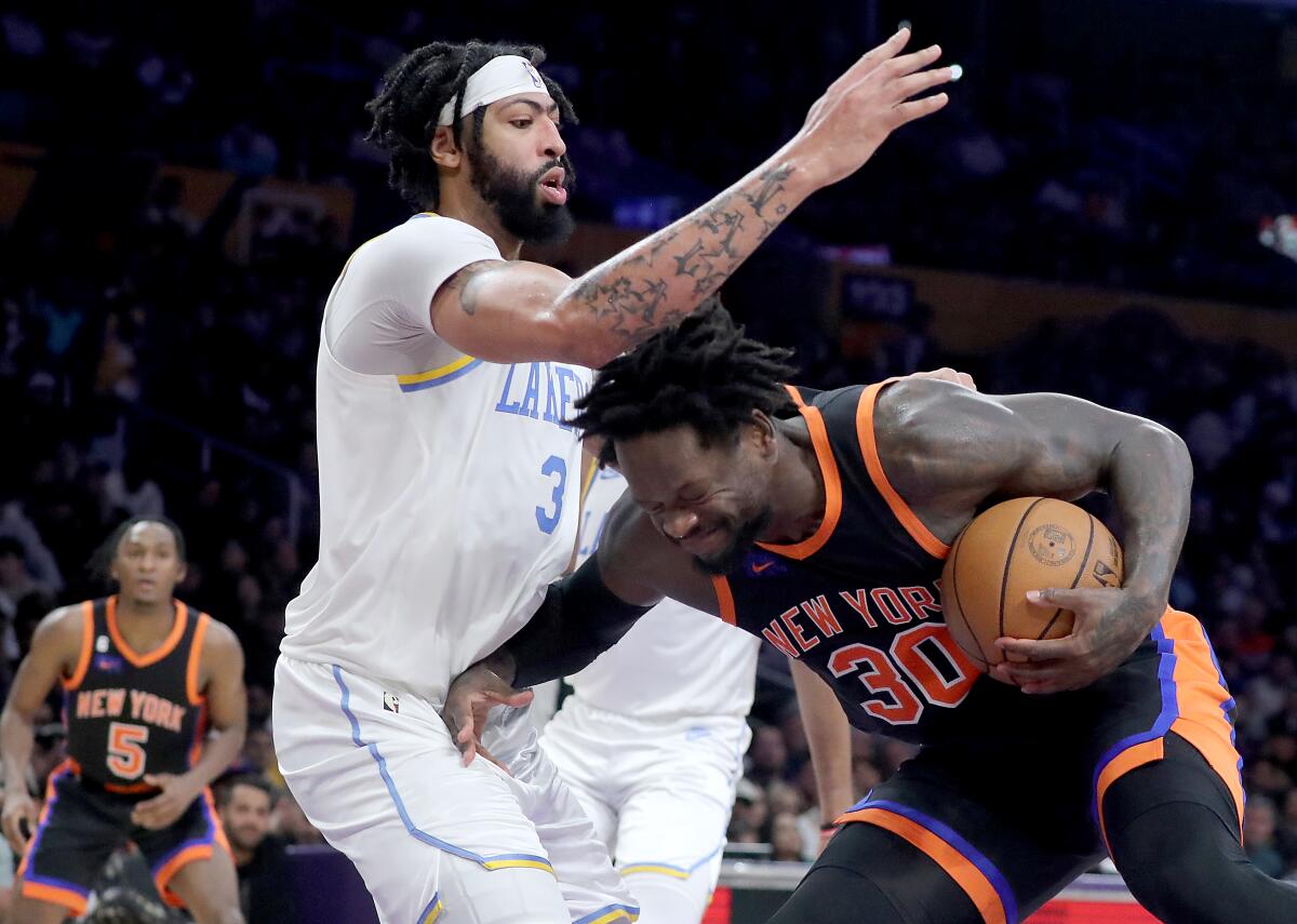 Lakers forward Anthony Davis tries to cut off a drive by Knicks forward Julius Randle.