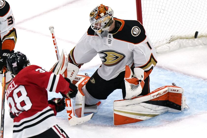 Ducks goalie Lukas Dostal cannot stop a goal by Blackhawks left wing Brandon Hagel during the second period Jan. 15, 2022.