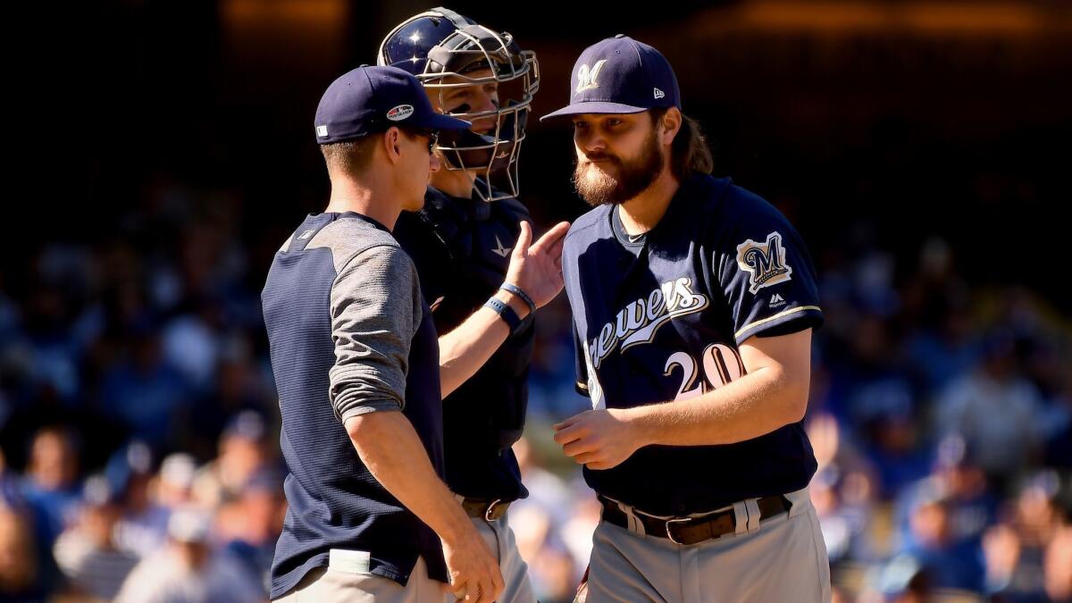Brewers starter Wade Miley is pulled by manager Craig Counsell after facing one Dodgers hitter in Game 5 of the National League Championship Series on Oct. 17.