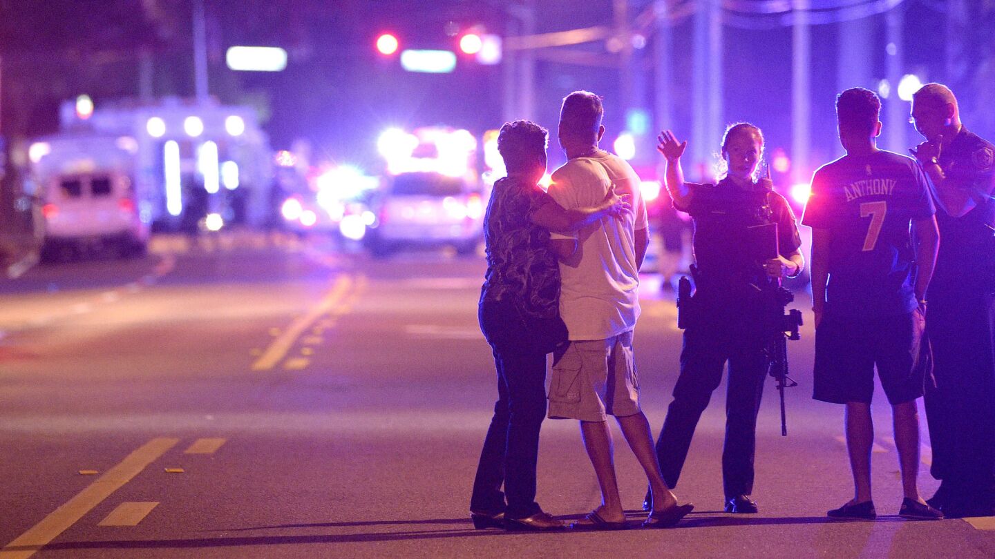 Orlando police direct family members away from the Pulse nightclub, where 50 people were killed.