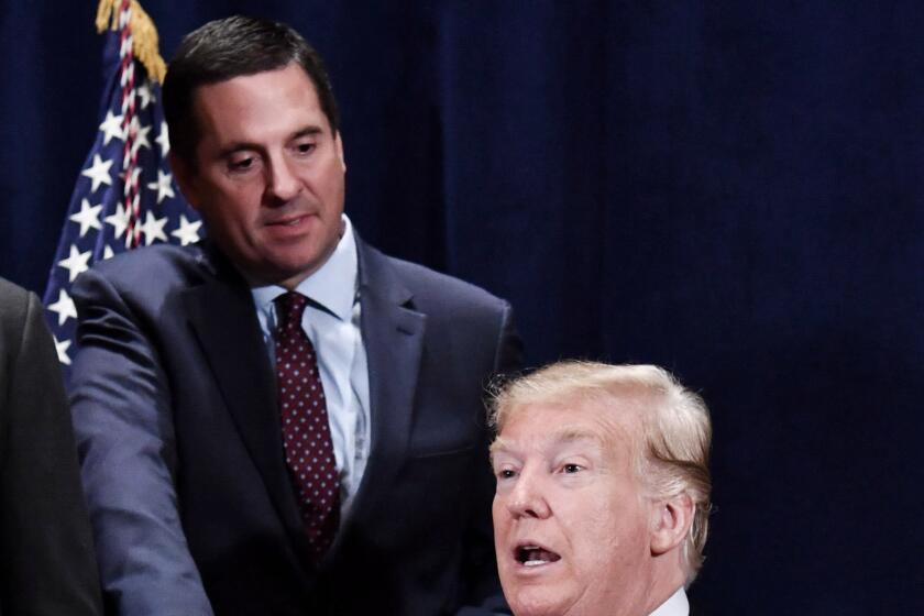 Former President Donald Trump shakes hands with Rep. Devin Nunes (R-CA) in 2018. (Photo by Nicholas Kamm / AFP via Getty) 
