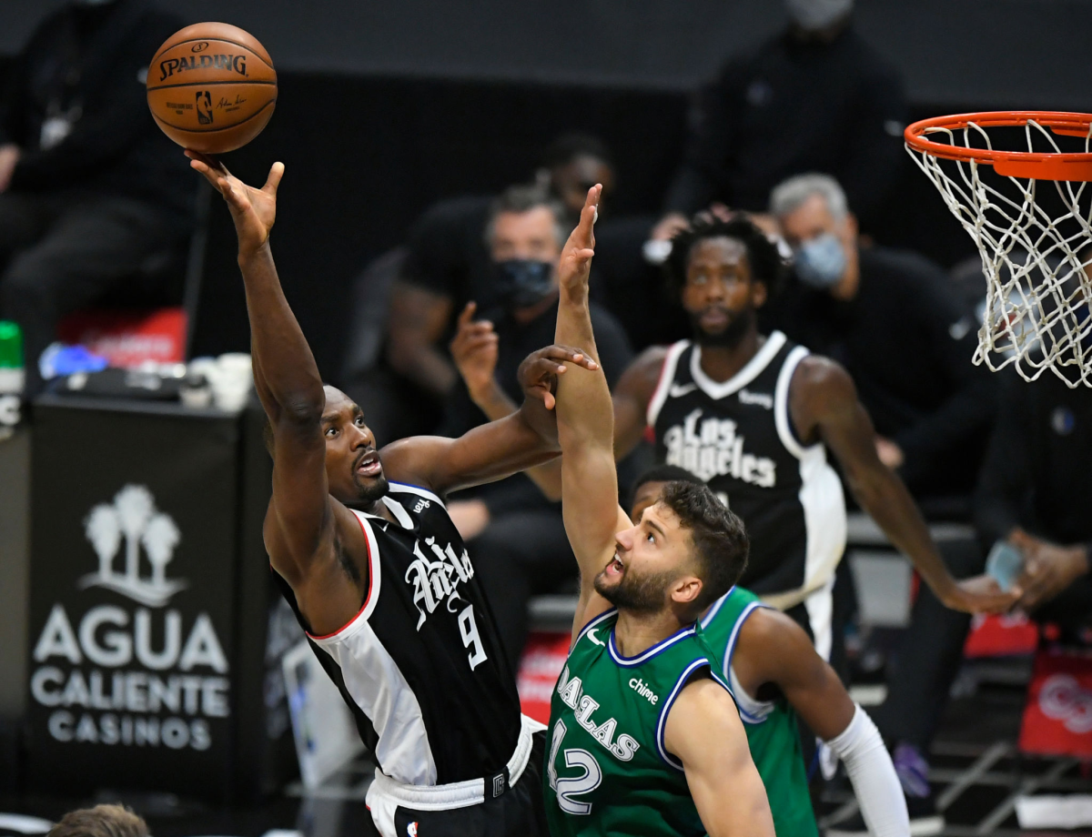 The Clippers' Serge Ibaka shoots over Dallas' Maxi Kleber on Dec. 27 at Staples Center.