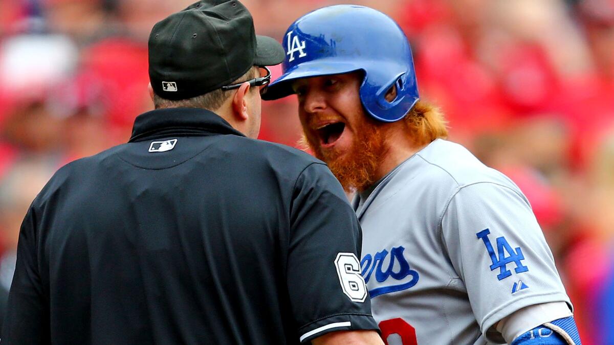 Dodgers third baseman Justin Turner argues a called third strike with home plate umpire Marty Foster that ended a 3-1 loss to the Cardinals on Sunday afternoon in St. Louis.