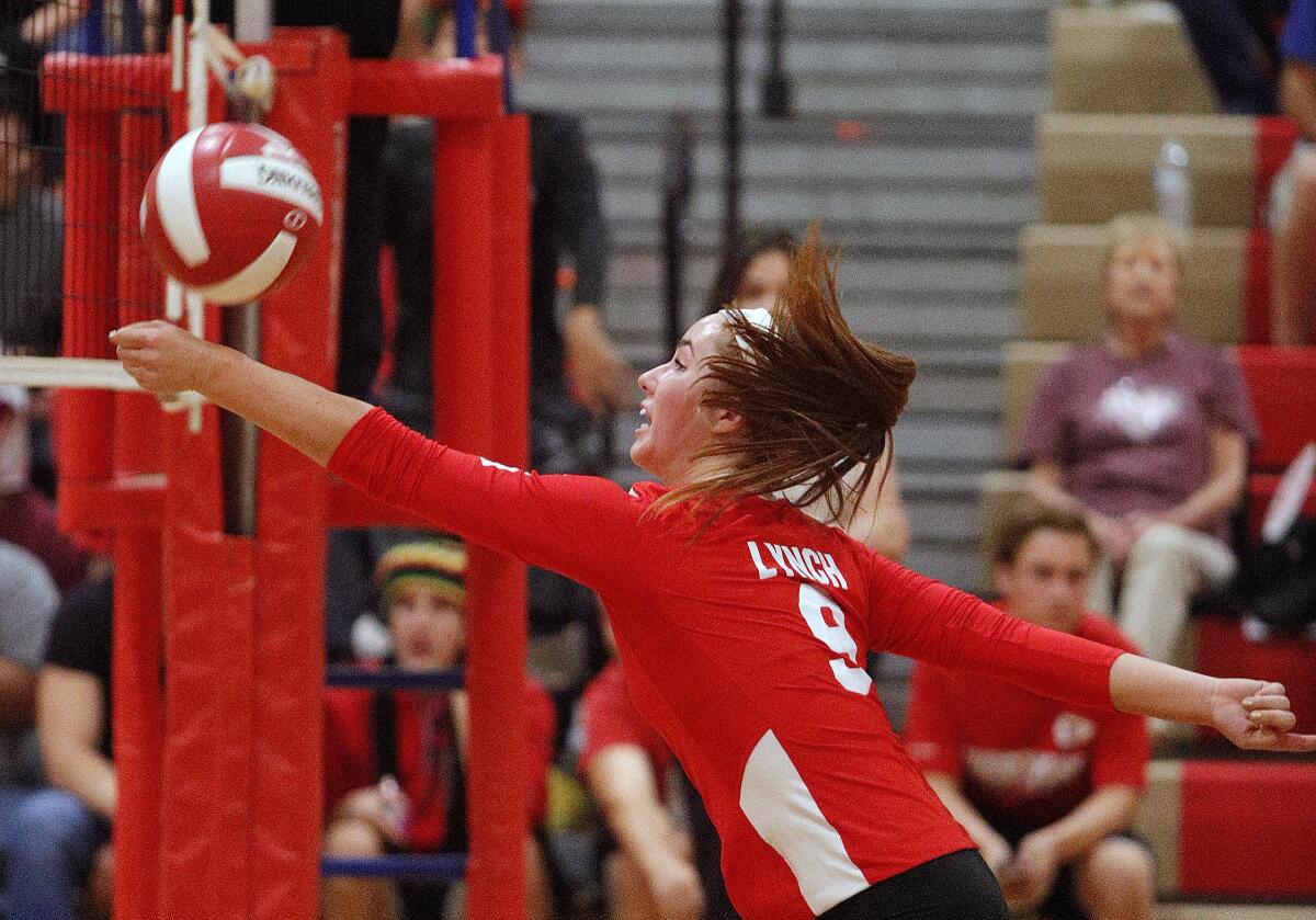 Burroughs' Meghan Lynch reaches out to keep a net shot in play against Murrieta Valley in a CIF Division II playoff girls' volleyball match at Burroughs High School on Thursday, October 24, 2019. Murrieta Valley won the match 3-0.