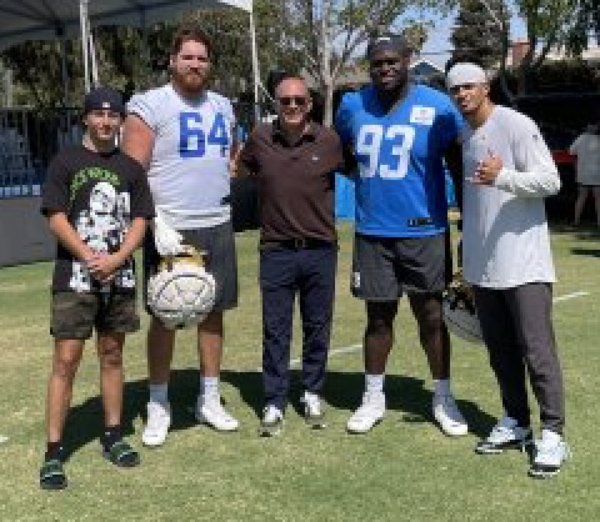 Priority Sports agent Kenny Zuckerman, center, stands with his son and three Chargers players.