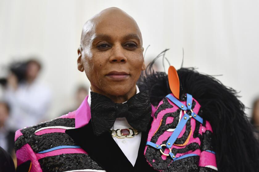 FILE - This May 6, 2019 file photo shows RuPaul at The Metropolitan Museum of Art's Costume Institute benefit gala celebrating the opening of the "Camp: Notes on Fashion" exhibition in New York. RuPaul is giving a dozen celebrities the chance to get drag makeovers for charity and bragging rights. VH1 said Tuesday, Oct. 22, that “RuPaul’s Celebrity Drag Race” will air as a limited series next year. (Photo by Charles Sykes/Invision/AP, File)