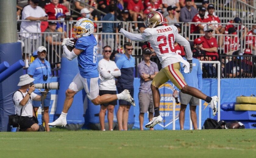 Chargers receiver Austin Proehl runs with the ball after a catch, with San Francisco 49ers cornerback Ambry Thomas in pursuit
