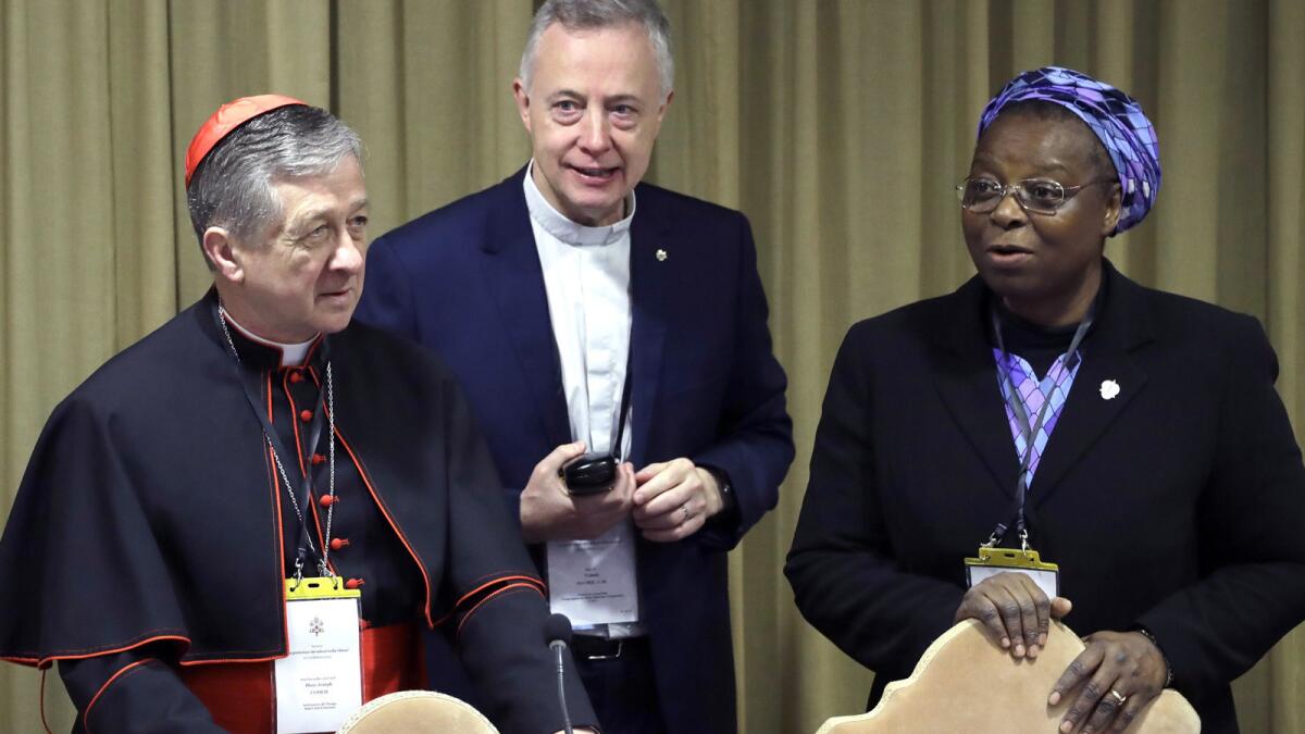 Sister Veronica Openibo with Chicago Archbishop Cardinal Blase J. Cupich, left, and Father Tomaz Mavric as they wait for Pope Francis to arrive at the third day of the Vatican's conference on the church's sexual abuse scandal on Feb. 23.