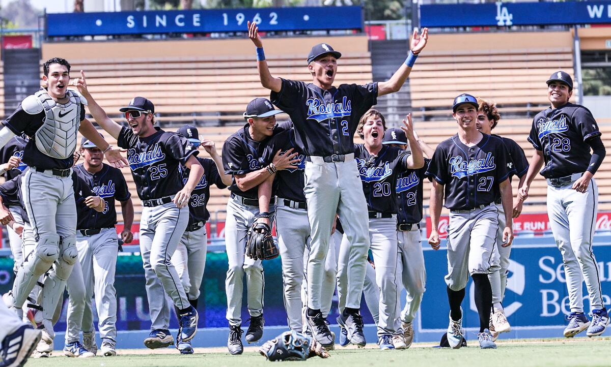 El Camino Real players celebrate winning a 10th City Section baseball title at Dodger Stadium.