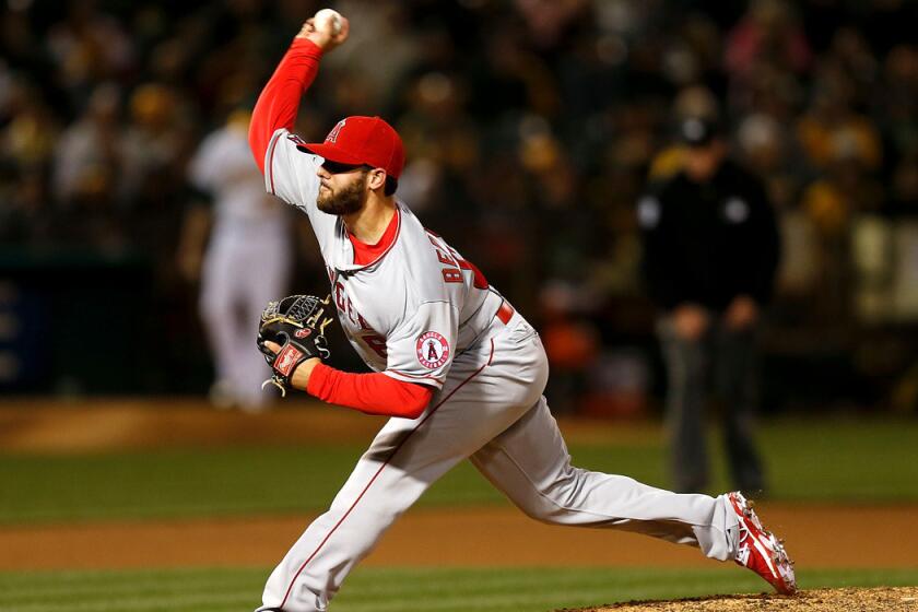 The Angels' Cam Bedrosian pitches against the Oakland A's on April 28. The reliever, waiting in the wings to return to the big leagues, has a 2.19 ERA in seven games for triple-A Salt Lake City. The Angels brought up Ryan Mattheus on Friday.