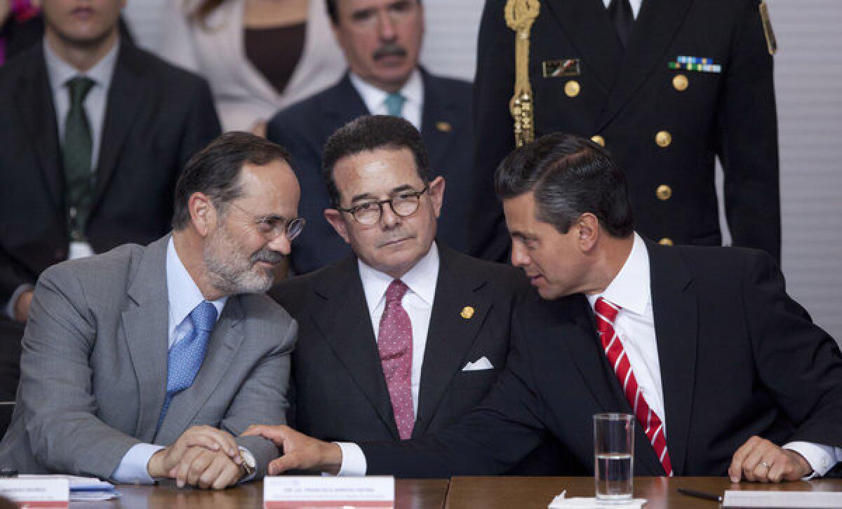 Mexico's president, Enrique Peña Nieto, right, speaks to the leader of the National Action Party, Gustavo Madero, left, during a meeting at the Technological Museum in Mexico City. With them is Francisco Arroyo Vieira, the Mexican Senate's deputy chairman.
