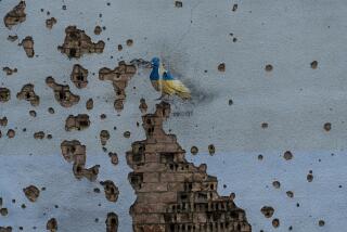 FILE - A dove painted by artist TvBoy adorns the wall of a building damaged by Russian shelling attacks in Irpin, Ukraine, Friday, July 7, 2023. Life in the capital of a war-torn country seems normal on the surface. In the mornings, people rush to their work holding cups of coffee. Streets are filled with cars, and in the evenings restaurants are packed. But the details tell another story. (AP Photo/Jae C. Hong, File)