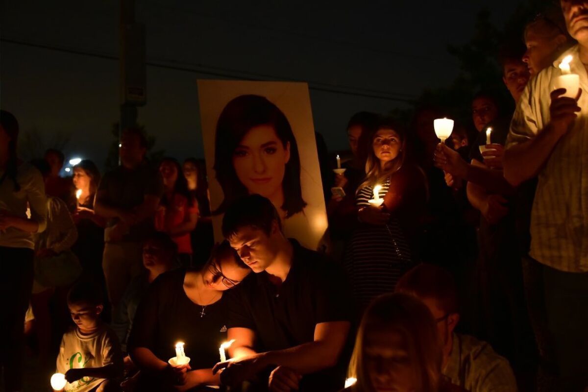 Friends mourn the loss of Christina Grimmie during a vigil last week in New Jersey.