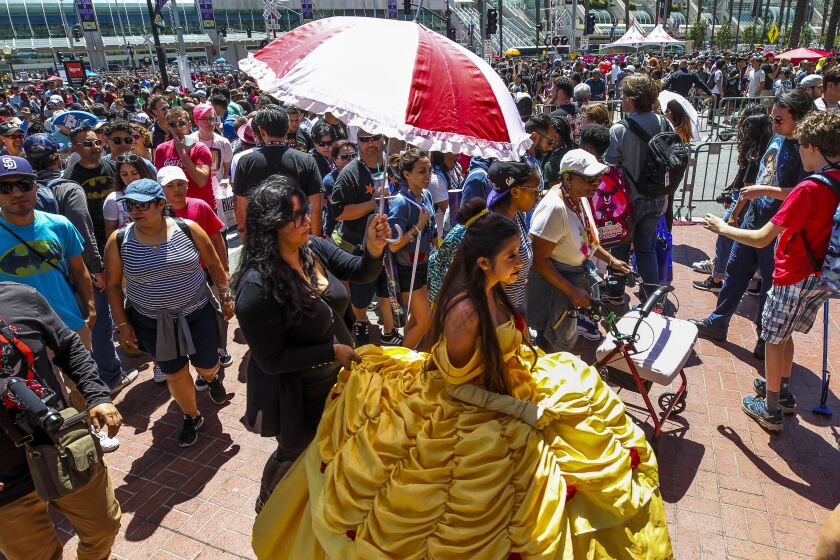 People flood on to Fifth Avenue during Comic-Con International on Saturday, July 20, 2019 in San Diego, California.