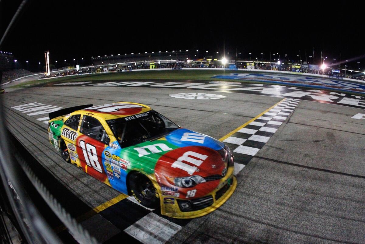 Kyle Busch crosses the finish line to win Sunday night's NASCAR Sprint Cup race at Atlanta Motor Speedway.