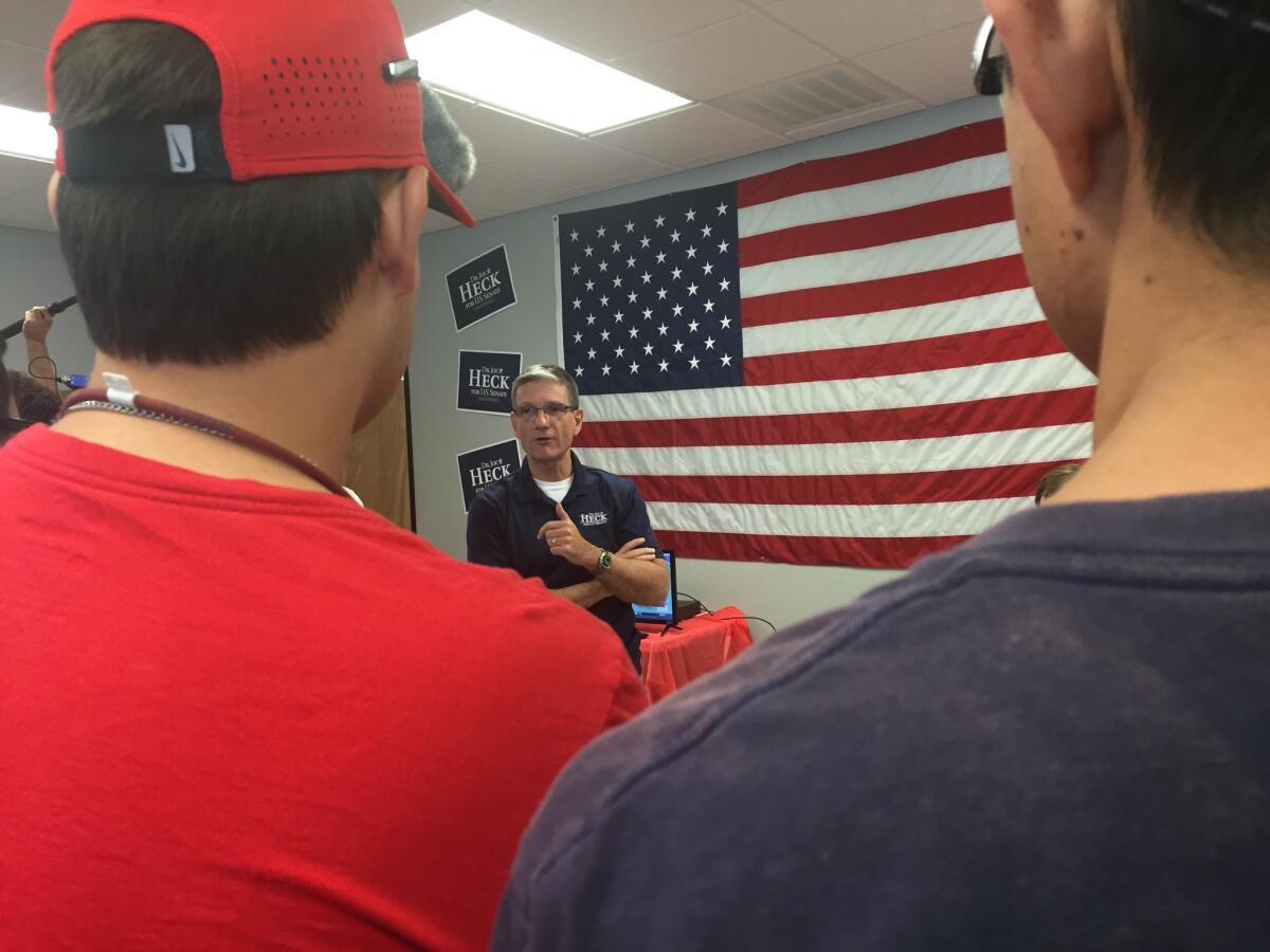 Republican Joe Heck talks with campaign volunteers in Nevada.