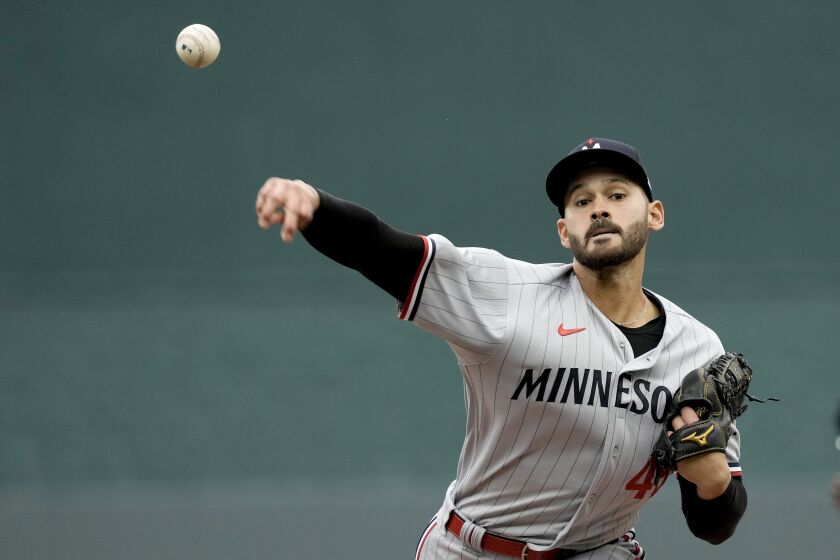 Minnesota Twins starting pitcher Pablo Lopez throws during the first inning of an opening day baseball game against the Minnesota Twins in Kansas City, Mo., Thursday, March 30, 2023. (AP Photo/Charlie Riedel)