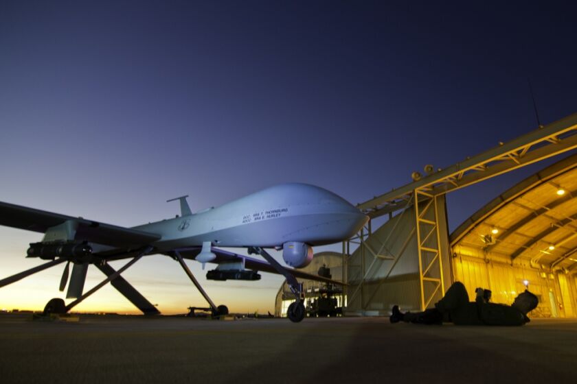 MQ-1 Predator is shown during post-flight inspection at dusk from Southern California Logistics Airport in Victorville, Calif., Jan. 7, 2012. (U.S. Air Force Photo by Tech. Sgt. Effrain Lopez)