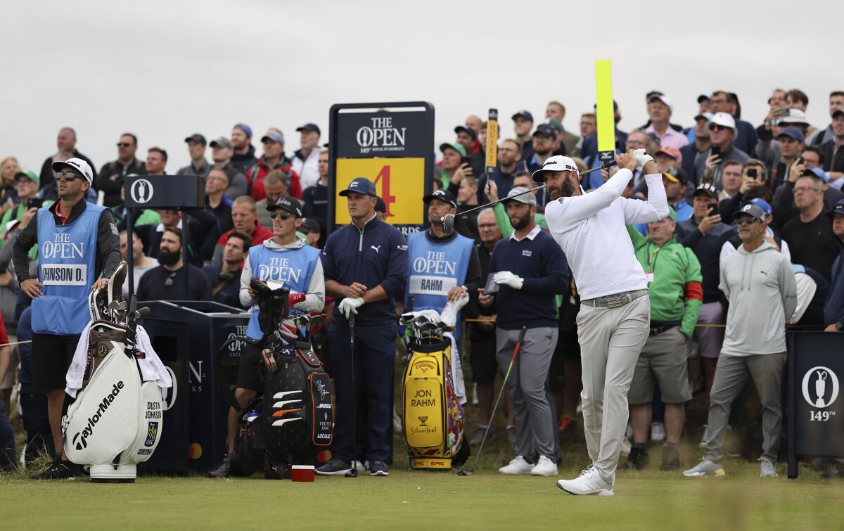 United States' Dustin Johnson plays his tee shot on the 4th during a practice round for the British Open Golf Championship at Royal St George's golf course Sandwich, England, Wednesday, July 14, 2021. The Open starts Thursday, July, 15. (AP Photo/Ian Walton)