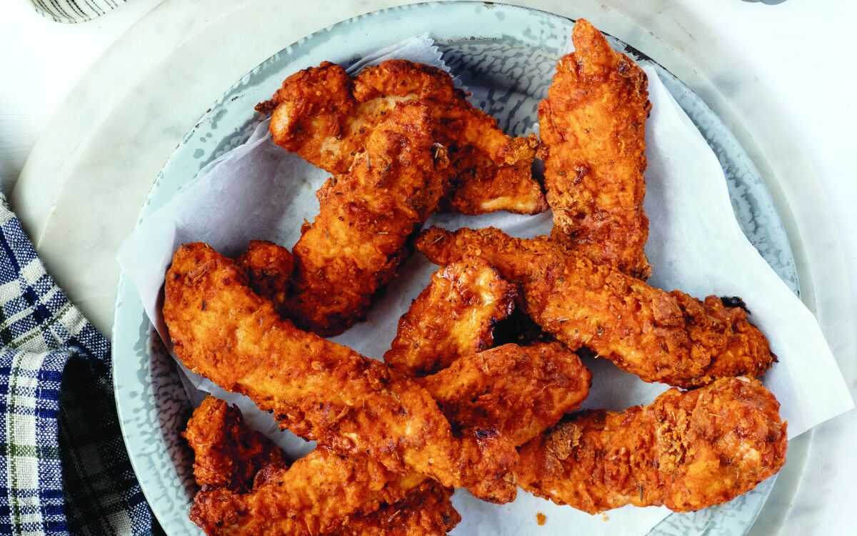 Chicken tenders are arranged on a plate
