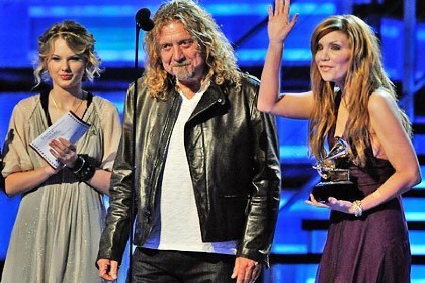 Alison Krauss (right) and Robert Plant took home five Grammy Awards last night, including Album of the Year for "Raising Sand." (Kevin Winter / Getty Images)
