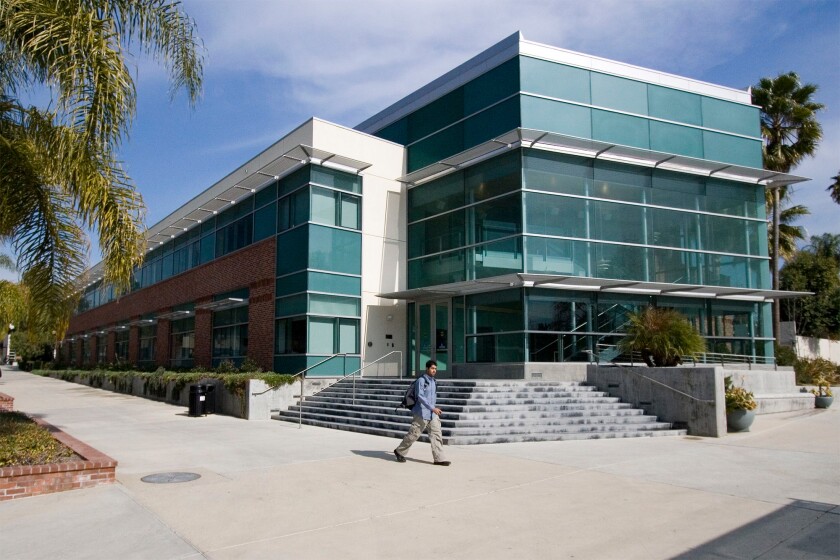A student walks past Spies-Bornemann Education and Technology Center on the Cal Lutheran campus.