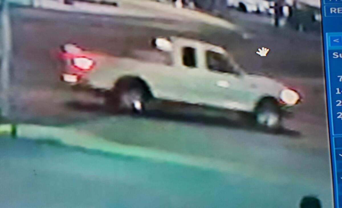Surveillance image of white pickup truck