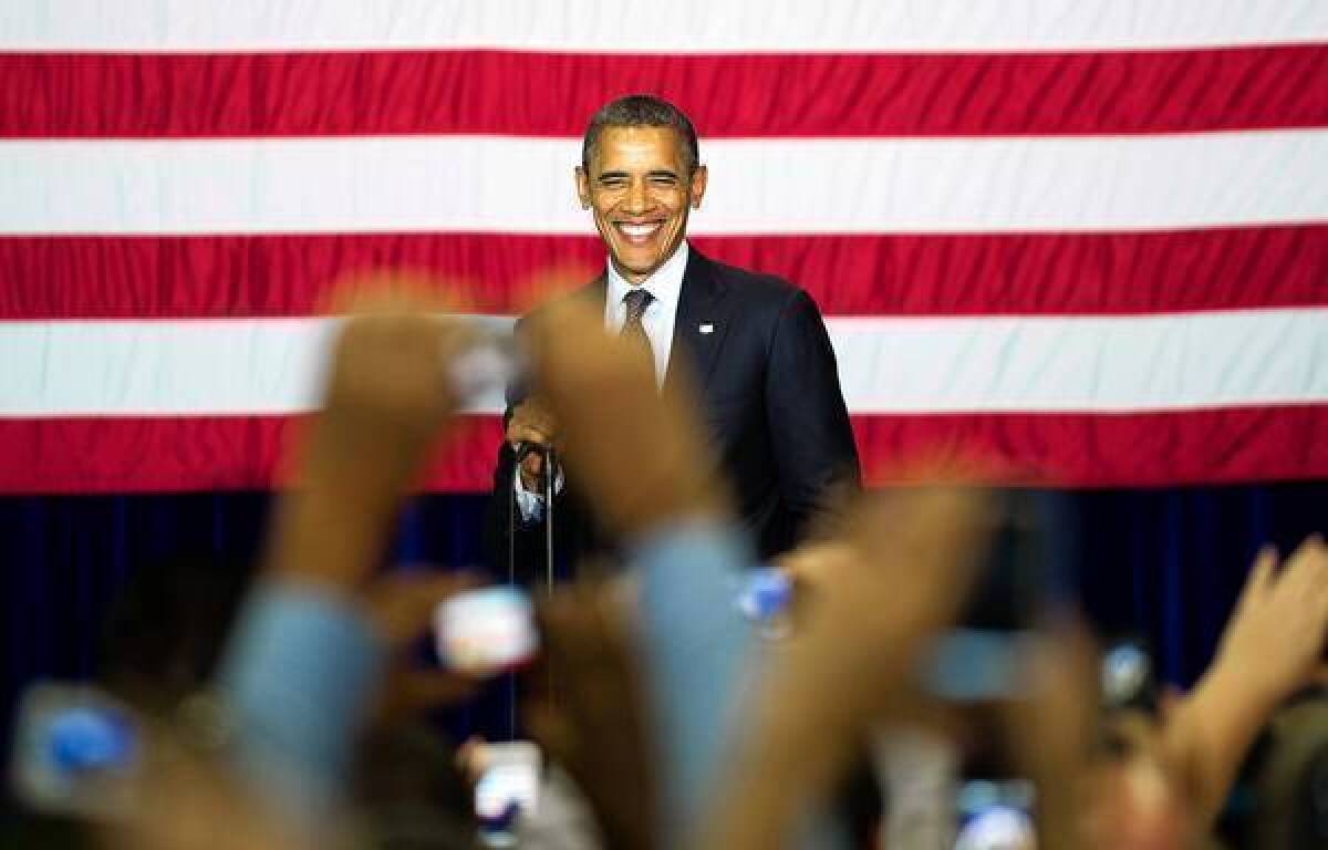 President Obama, beaming before a crowd in Las Vegas, has a slight lead over Republican presidential candidate Mitt Romney in a new nationwide poll.