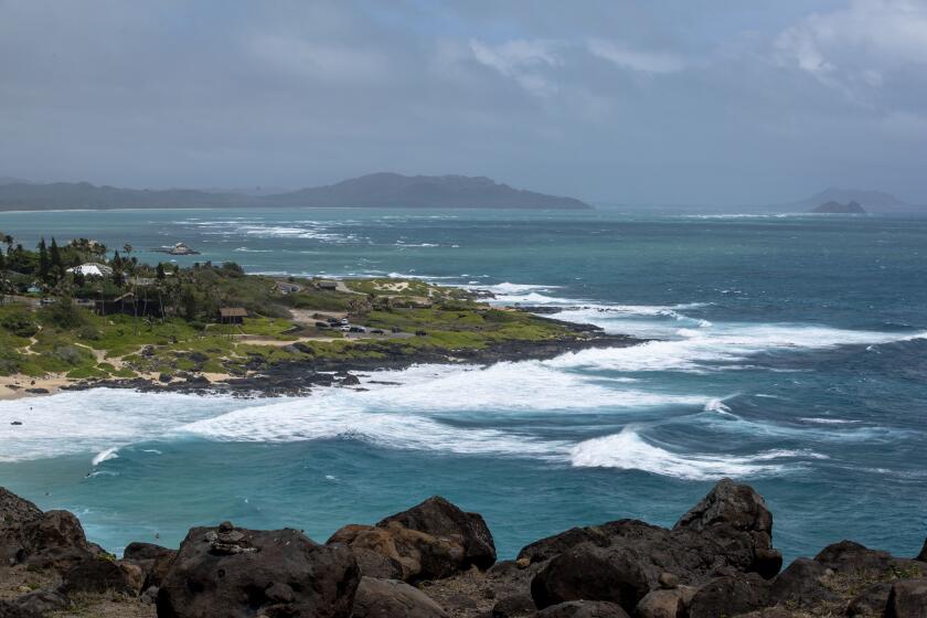 High surf breaks on Oahu's Windward coast as seen from the Makapuu Lookout, Sunday, July 26, 2020, in Honolulu. The high winds and big surf are being generated by Hurricane Douglas. (AP Photo/Eugene Tanner)