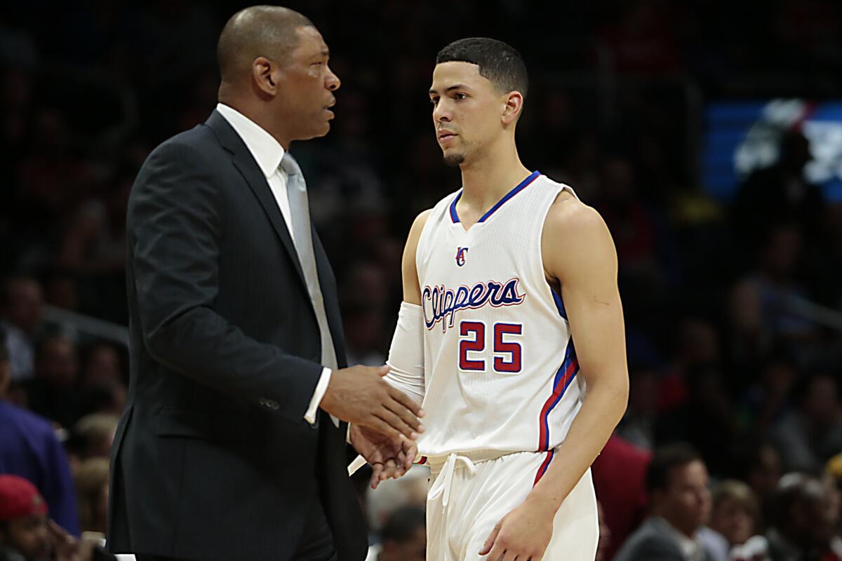 Clippers coach Doc Rivers and his son Austin during a game earlier this season.